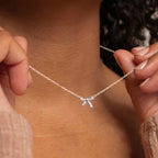 SLUYNZ 925 Sterling Silver Small Bow Pendant Necklace for Women Teens CZ Bow Necklace Chain Ribbon Necklace Choker