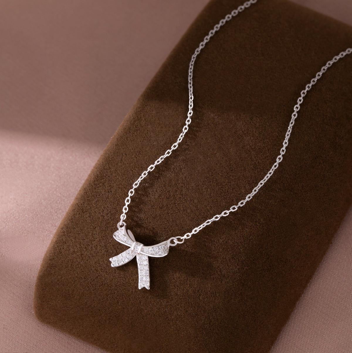 SLUYNZ 925 Sterling Silver Small Bow Pendant Necklace for Women Teens CZ Bow Necklace Chain Ribbon Necklace Choker