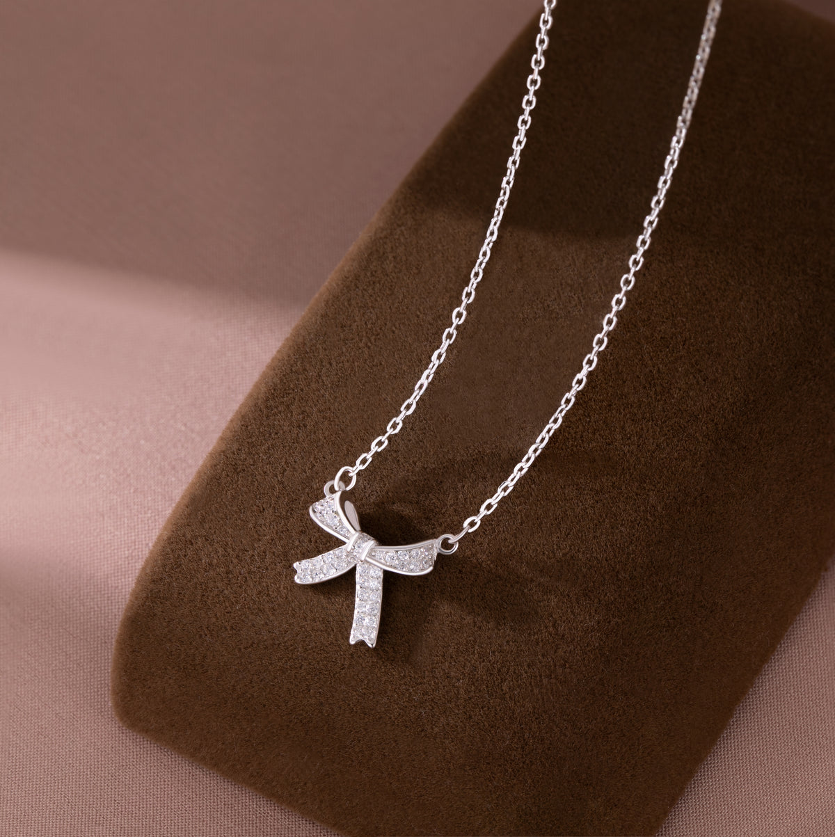 SLUYNZ 925 Sterling Silver Small Bow Pendant Necklace for Women Teens CZ Bow Necklace Chain Ribbon Necklace Choker