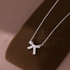 SLUYNZ 925 Sterling Silver Small Bow Pendant Necklace for Women Teens CZ Bow Necklace Chain Ribbon Necklace Choker